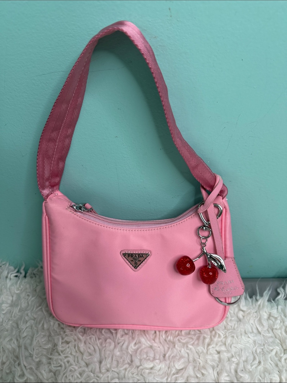 Nylon Pink Shoulder Bag with Cherry Charm with a small cart holder.
